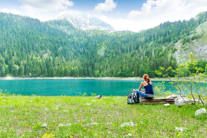 invitation to rest, woman by beautiful lake